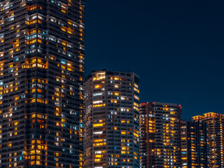 Illuminated High-Rise Apartment Towers at Night in Tokyo © YUTAKA