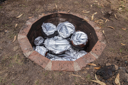 The traditional Andean process of preparation of Pachamanca, a method of cooking meats, vegetables over hot stones placed in an underground earth oven. 