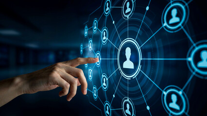 Fototapeta premium A person's finger is touching a digital screen, activating a network of connected people icons, symbolizing connection and technology