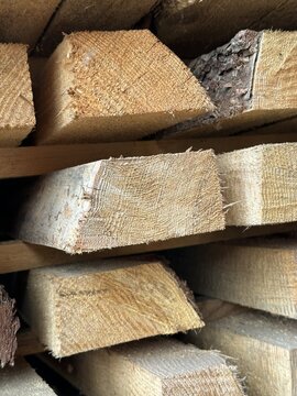 Macro close-up of sawn timber end-grain texture in a stack