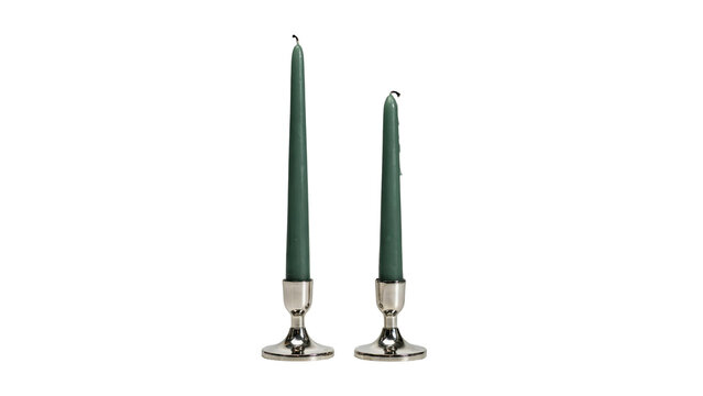 Two tall green taper candles held in silver on transparent background