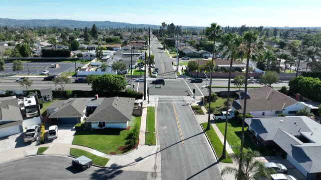 Palm trees frame an aerial view of a neighborhood in Yorba Linda, California, USA.