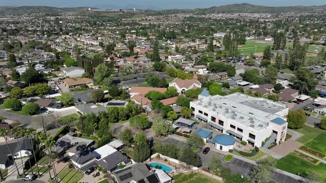 Palm trees frame an aerial view of a neighborhood in Yorba Linda, California, USA.