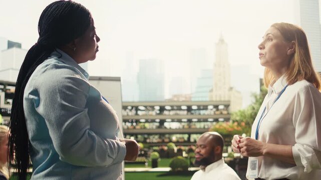 Professional handshake agreement between businesswomen outdoors, showing commitment and successful one on one negotiation, trust and cooperation between partners, for business agreement.