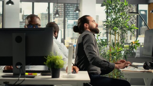 Colleagues collaborate on project planning inside a shared office, combining project plans and reports while they organize objectives for a practical workflow.