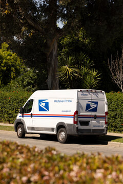 Yorba Linda, California, USA - March 14, 2026: A United States Postal Service van makes a delivery on a neighbrohood street.