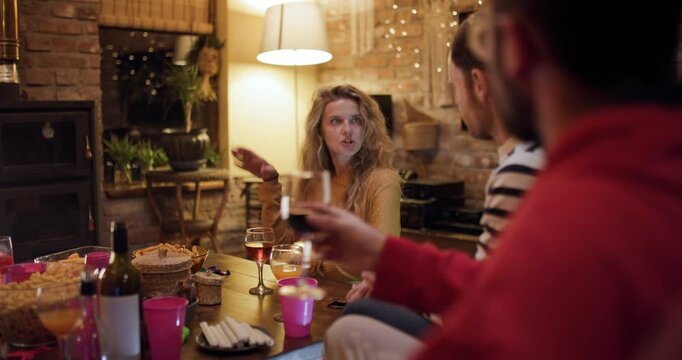 Girl celebrates birthday with friends at home with party games and snacks in a cozy setting during evening hours
