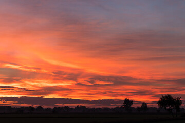 Obraz premium Sky orange and yellow countryside.