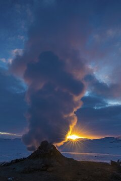 Mud pot with steam source at sunrise, Hverir solfataras field, fumaroles, snow-covered geothermal area, Northern Iceland Eyestra, Iceland