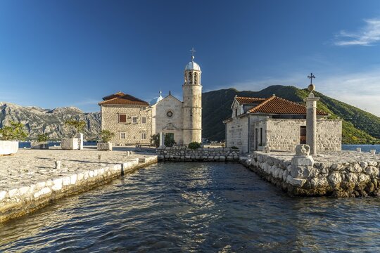 The artificial island of Gospa od Skrpjela with the church of St. Mary on the rock near Perast on the Bay of Kotor, Montenegro