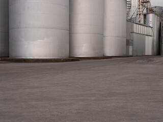 Car background, automotive backplate, industrial storage silos for oil, fuel, grain. © Chris