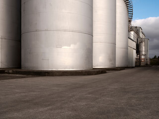 Car background, automotive backplate, industrial storage silos for oil, fuel, grain. © Chris