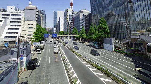 A timelapse of traffic jam at the urban city street in Tokyo wide shot panning