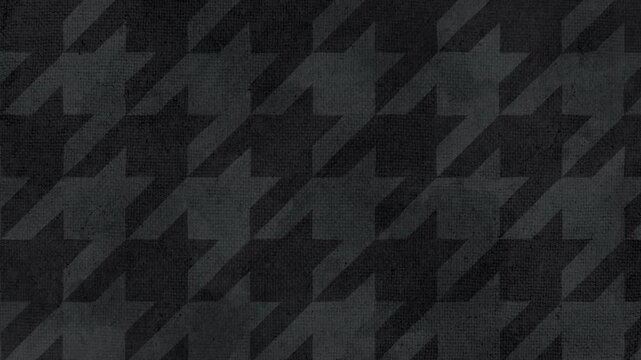 A seamless loop video of a large houndstooth pattern in a chic dark gray color with a warm hand drawn style texture.