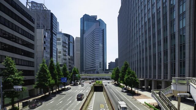 A timelapse of traffic jam at the urban city street in Tokyo wide shot panning