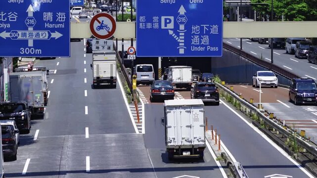A timelapse of traffic jam at the urban city street in Tokyo panning