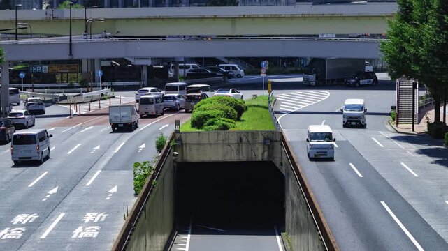 A timelapse of traffic jam at the urban city street in Tokyo telephoto shot tilt