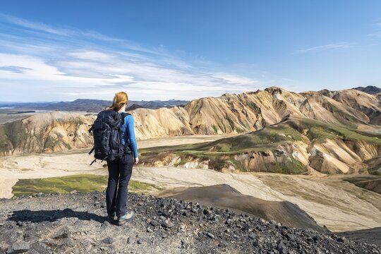 Female hiker, Rhyolite mountains, Landmannalaugar region, Fjallabak nature reserve, Icelandic highlands, Iceland