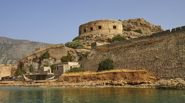 Ancient fortress with round tower on the coast, surrounded by water and rocks, Venetian sea fortress, Leper Island, Spinalonga, Elounda Bay, Mirabello Bay, East Crete, Crete, Greek Islands, Greece