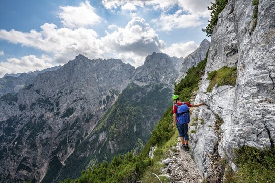 Young hiker on the Sentiero Carlo Minazio path, Sorapiss circuit, Dolomites, Belluno, Italy