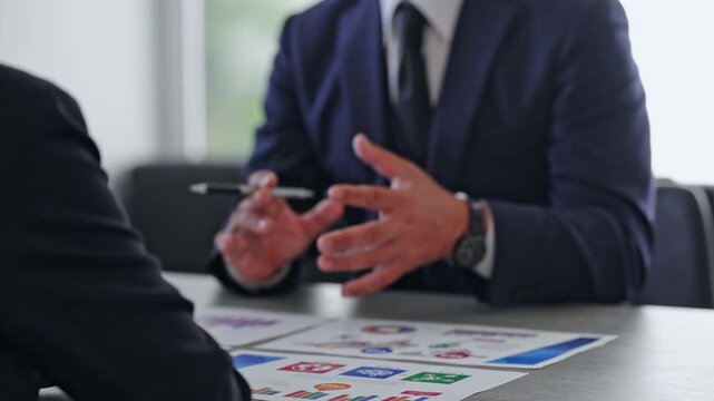 Male and female business professionals in a meeting. Business negotiations, consulting, proposals, advisory, conferences, management, interviews, consultations, and planning meetings.