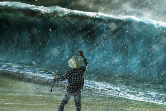 Fisherman facing giant tsunami wave on stormy beach