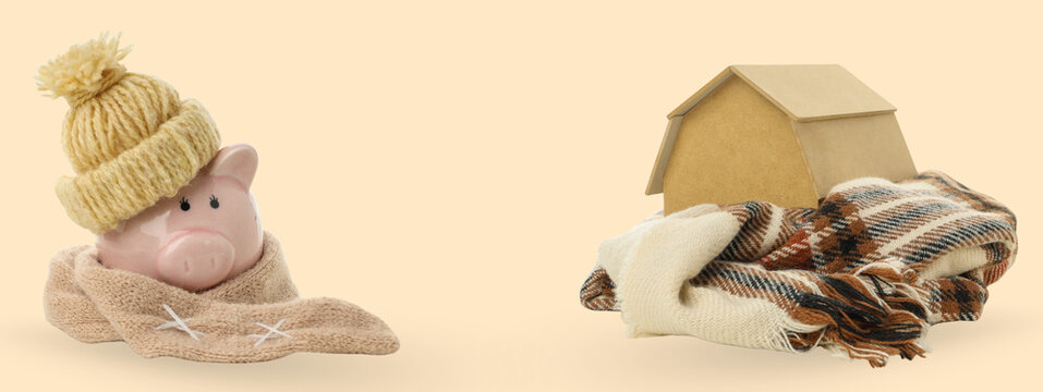 A piggy bank in a hat and scarf by a cozy house