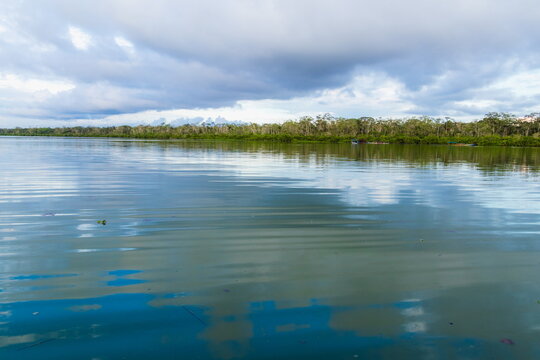 Beautiful view of Limoncocha Lagoon with its deep green-blue water surrounded by lush tropical forest in the Amazon Basin (Limoncocha National Biological Reserve), Sucumb&iacute;os Province, Ecuador.