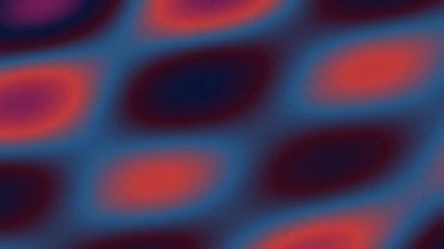 Abstract pattern of blurred red and dark blue oval shapes on a blue background, creating a dynamic visual effect.