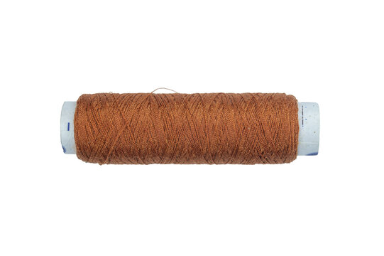 Brown sewing thread spool for embroidery isolated on a transparent background view.