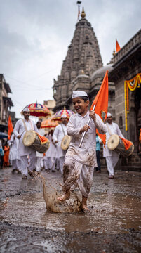 Accompanying the Wari pilgrimage, with unfurling saffron flags and devotional music