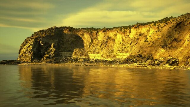 Field geologist surveying layered cliffs at golden hour, sampling strata and documenting outcrop texture, visible sediment bands and fossil hints,