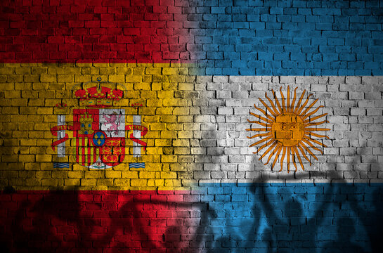 Empty Red Brick Wall with argentina and spain flags