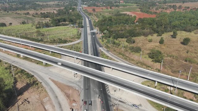 Drone footage aerial view scenic landscape of Traffic of many types of vehicles on the highway