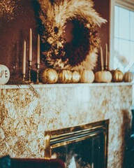 Obraz premium Opulent veined marble fireplace mantel decorated with a dried flower wreath and gold pumpkins for elegant autumn home decor and seasonal interior design