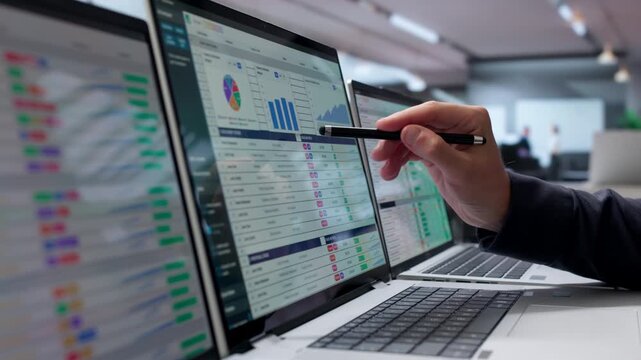 Medical Billing Coder Reviews Spreadsheet Data On Laptop