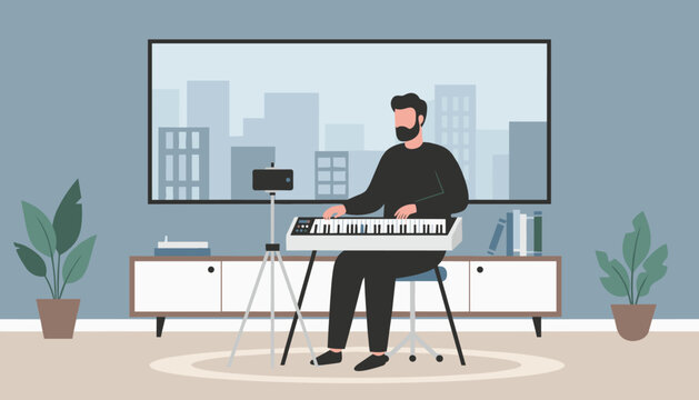 Man with a beard playing a digital piano synthesizer keyboard while livestreaming a video in his modern apartment.