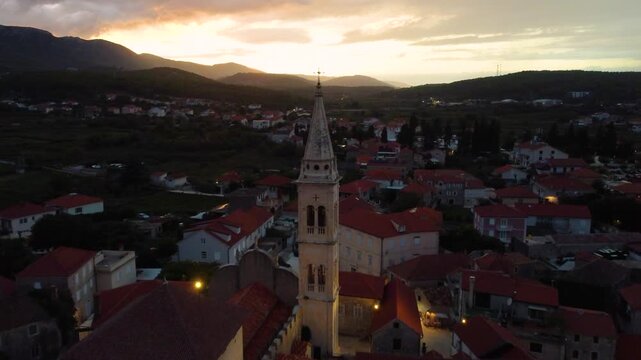 Parish of the assumption of mary in jelsa, hvar, croatia at sunset