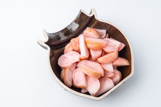 A jar of pickled radish cut into chunks