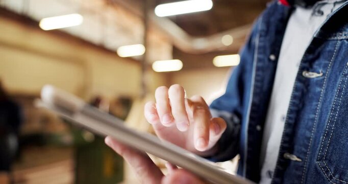 Carpentry, hands and tablet with man in workshop for planning, digital schedule or timetable. Furniture, warehouse and scrolling app with person in woodworking factory for online agenda or inventory