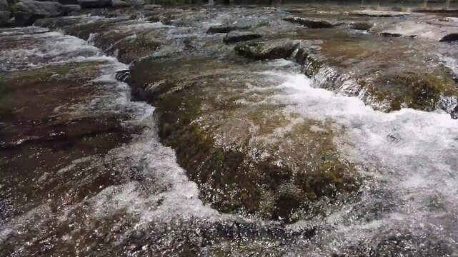 Close-up of Fresh Water Flowing Over Rocks in a Mountain Stream