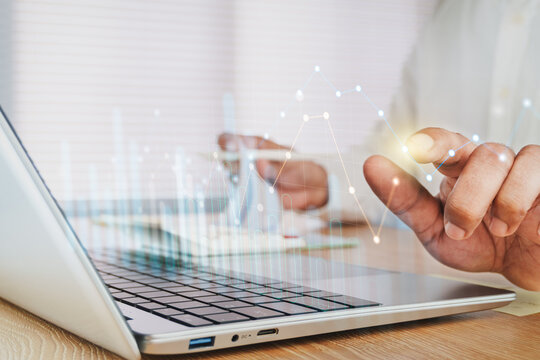 Business Professional Using Laptop, calculator and document with Interactive Financial Analytics Dashboard, KPI Performance Monitoring, Investment Analysis, Business Intelligence, Digital Finance