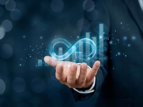 Man in suit holding glowing blue infinity symbol with bar graphs