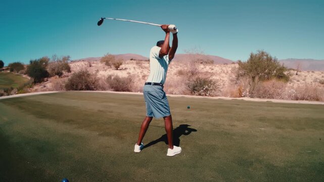 African American male golfer hits driver in ultra slow motion on desert golf course on sunny day, 4k 800fps slowmo golf instruction