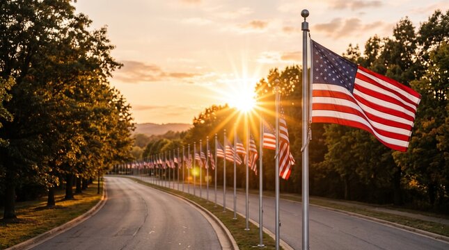 A scenic road flanked by numerous American flags fluttering proudly under a radiant sunburst, evoking a sense of solemn remembrance and national unity