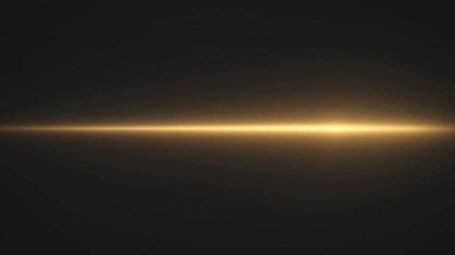 Horizontal golden light streak emanating from the left edge against a solid dark grey background, soft glowing lens flare