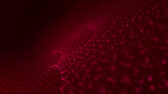 Glowing red particle wave on dark background. Seamless looping abstract blurred dots animation.