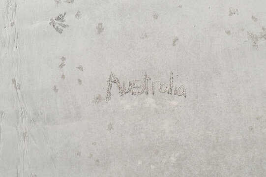 Australia - Top Down written in the sand at the beach.