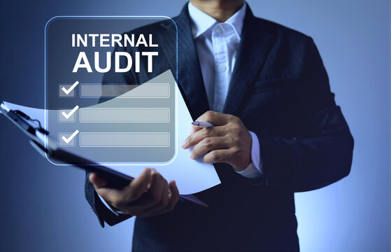internal audit concept with auditor holding document folder represents business activity inspection complaint on management system under standards requirements