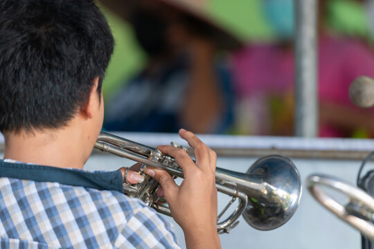 Musician playing trumpet during live performance Close up of brass instrument skilled hands creating music for entertainment concert cultural events